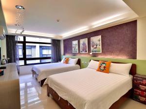 Una cama o camas en una habitación de 漫調子 Roaming Life B&B