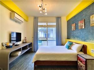 Una cama o camas en una habitación de 漫調子 Roaming Life B&B