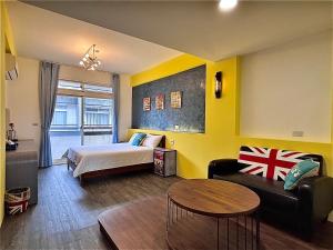 Una cama o camas en una habitación de 漫調子 Roaming Life B&B