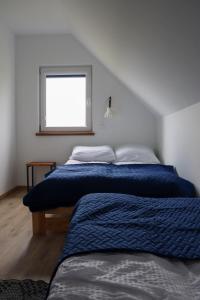 Postel nebo postele na pokoji v ubytování Domki Ostoja Kaszëbë + 16 fotografií