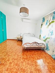 a bedroom with a bed and a wooden floor at Casa Elena in Orcera +20 photos