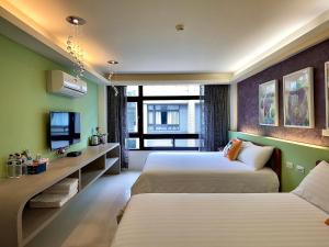 Una cama o camas en una habitación de 漫調子 Roaming Life B&B