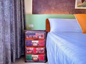 Una cama o camas en una habitación de 漫調子 Roaming Life B&B