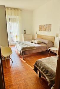 Posteľ alebo postele v izbe v ubytovaní Appartamenti Giulia - Palazzo Milano + 37 fotografií