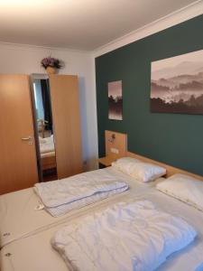 two twin beds in a room with at Apartment Morgengruß - Pool & Sauna in Hohegeiß