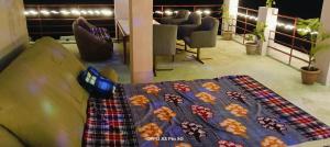 a table with a quilt on it in a room at Palmquist Villa in Neral