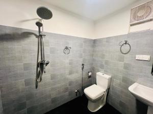 a bathroom with a toilet and a sink at Lagoon House - Hiriketiya in Dickwella +51 photos
