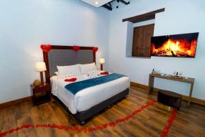 Postel nebo postele na pokoji v ubytování Hotel Boutique MR