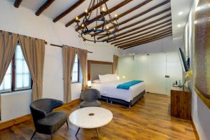 Postel nebo postele na pokoji v ubytování Hotel Boutique MR + 19 fotografií