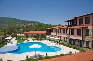 a view of a swimming pool at a resort at Hotel Domaine Peshtera in Peshtera