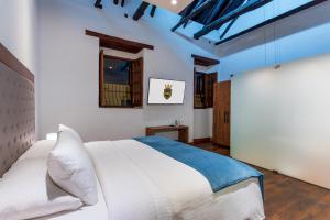 Postel nebo postele na pokoji v ubytování Hotel Boutique MR