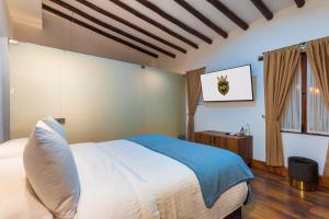 Postel nebo postele na pokoji v ubytování Hotel Boutique MR