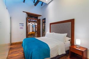 Postel nebo postele na pokoji v ubytování Hotel Boutique MR