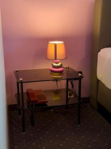 A bed or beds in a room at Pension Erlaa