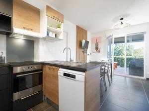 a kitchen with a sink and a dishwasher at La Dune 29 - VILLA 4P9 in Valras-Plage