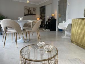 a living room with a table and chairs at Casino Apartment in Ostend