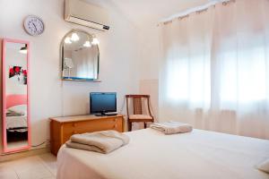 Postel nebo postele na pokoji v ubytování Verdaguer Home