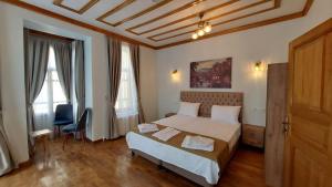 Postel nebo postele na pokoji v ubytování Fevzi Pasa Suite