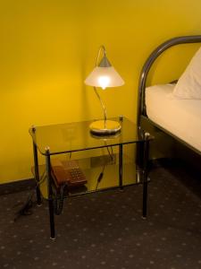 A bed or beds in a room at Pension Erlaa