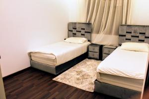 Ένα ή περισσότερα κρεβάτια σε δωμάτιο στο شقق الاسد افران