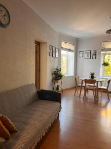 a living room with a couch and a table at Nice&cozy flat No7 in Riga
