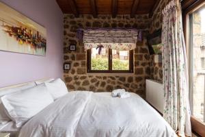 Ένα ή περισσότερα κρεβάτια σε δωμάτιο στο Ornytion Cozy House