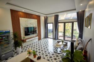 TV a/nebo společenská místnost v ubytování Sweet Apartment Sa Pa