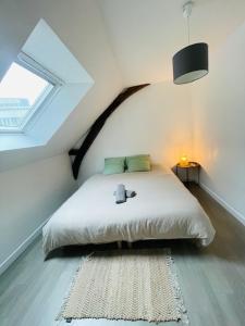 Ένα ή περισσότερα κρεβάτια σε δωμάτιο στο Le Duplex - Hyper Centre-Ville - 6 voyageurs