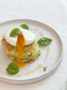 a white plate with an egg dessert on it at CinziaHome Boutique B&B Spiaggia Privata in Lido di Fermo