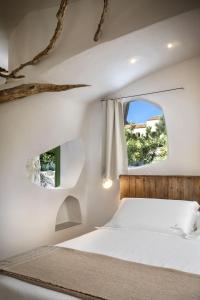 Postel nebo postele na pokoji v ubytování Gallicantu Stazzo Retreat + 37 fotografií
