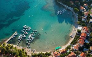 an aerial view of a beach with boats in the water at Apartments BePa in Lopar