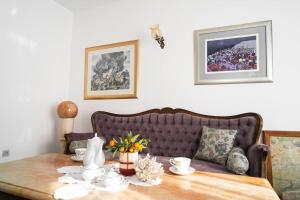 a living room with a table and a couch at House Villa Oaza in Rogoznica