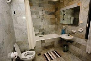 a bathroom with a toilet and a sink at House Villa Oaza in Rogoznica +37 photos