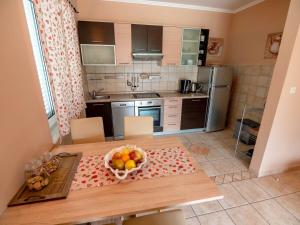 Kuchyň nebo kuchyňský kout v ubytování Apartments Keko