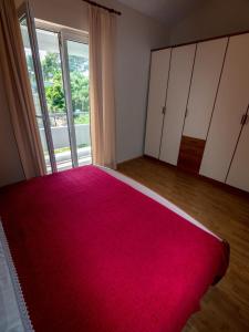 Postel nebo postele na pokoji v ubytování Apartments Keko