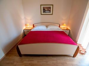 Postel nebo postele na pokoji v ubytování Apartments Keko