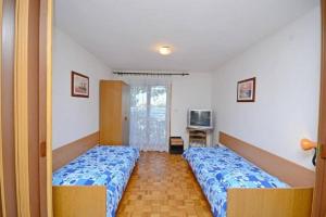 Postel nebo postele na pokoji v ubytování Apartments Dane