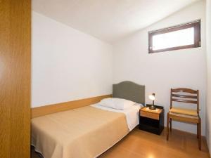 Postel nebo postele na pokoji v ubytování Apartments Dane