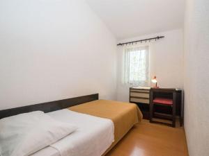 Postel nebo postele na pokoji v ubytování Apartments Dane