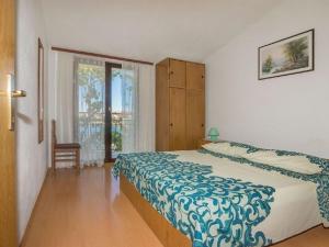 Postel nebo postele na pokoji v ubytování Apartments Dane