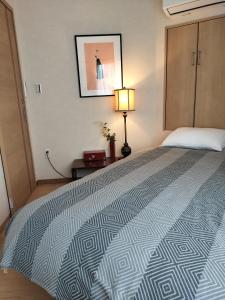 Postel nebo postele na pokoji v ubytování 源氏民宿