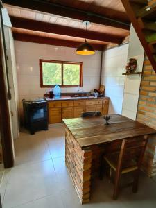 Køkken eller tekøkken på Casa Praia Do Rosa