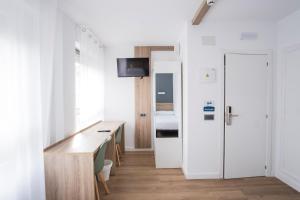 TV a/nebo společenská místnost v ubytování Residencia Zeta Home