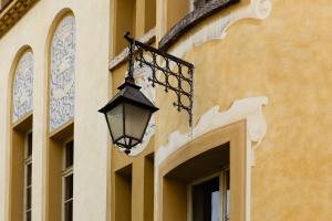 a street light attached to the side of a building at Grand Hotel Fasano in Gardone Riviera +161 photos