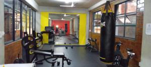 a gym with a punching bag in a room at Albert Park Lodge in Durban