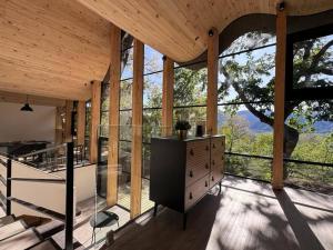 a large room with a large window in a house at Conguillio Lava Cave in Melipeuco
