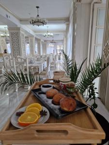 a tray of food on a table in a room at Pension Elegance in Gura Humorului