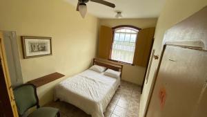 Postel nebo postele na pokoji v ubytování Brumas Ouro Preto Hostel e Pousada
