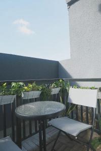 a table and two chairs and a table and chairs on a balcony at Cityscape Grand in Cebu City