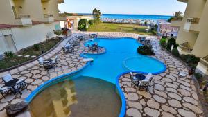 an overhead view of a swimming pool at a resort at Magic Beach Hotel Hurghada in Hurghada